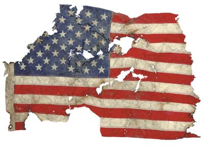 Small American flag recovered amid World Trade Center debris at the Fresh Kills Landfill. 9-11 exhibit at the East Tennessee History Museum. 2003 Smithsonian photo by Hugh Talman.